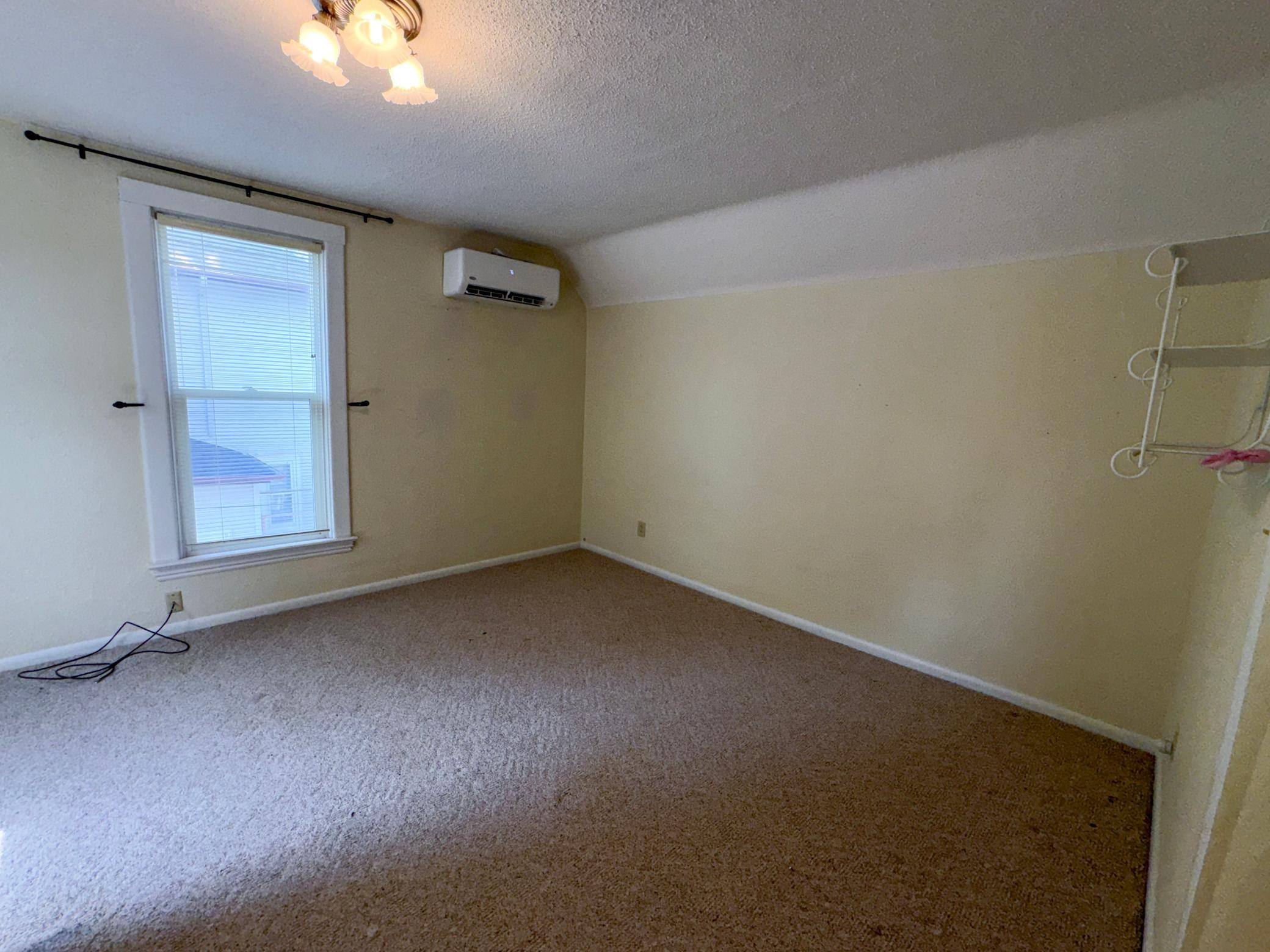 Spacious upstairs bedroom with private full bathroom.