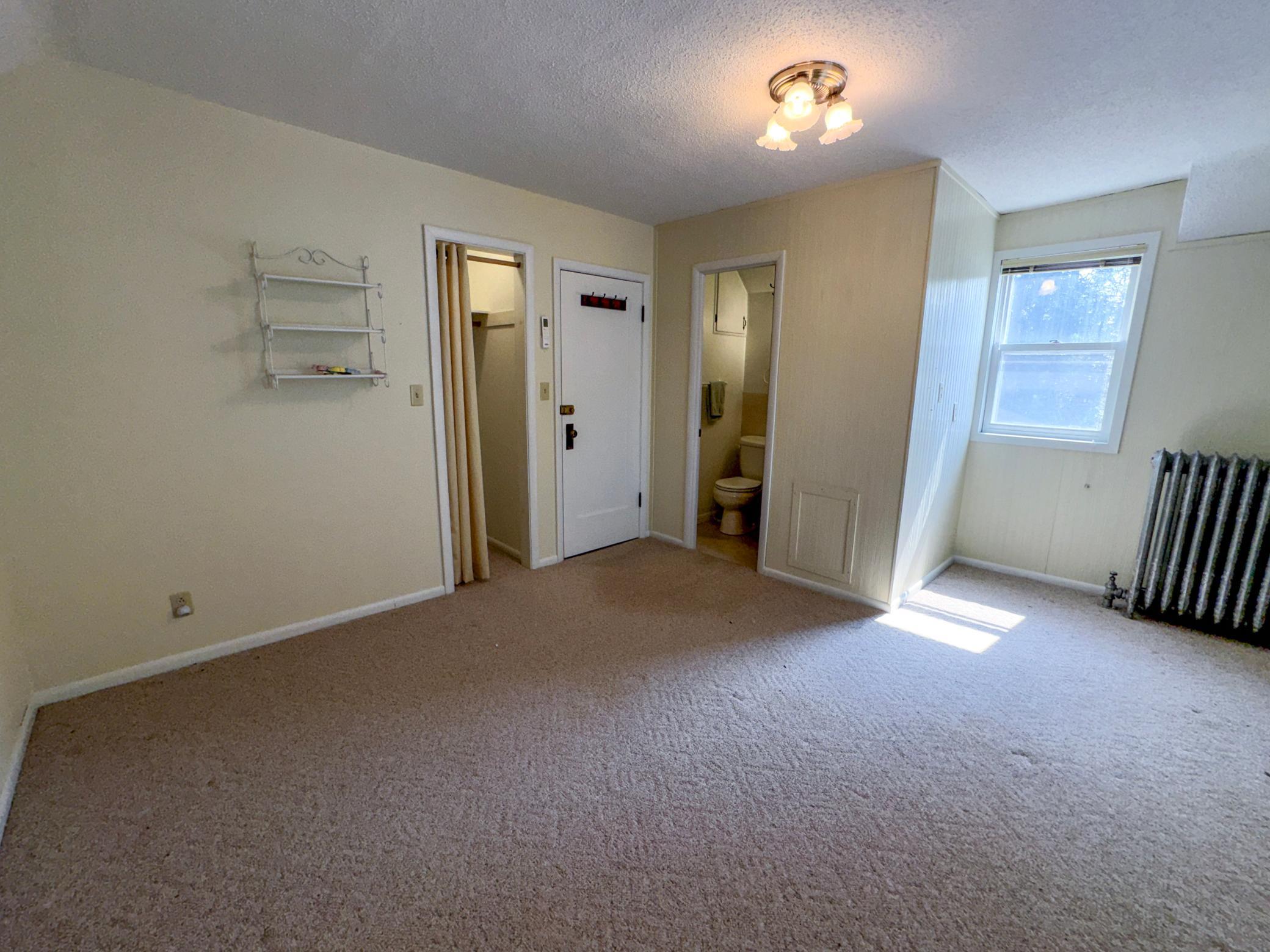 Spacious upstairs bedroom with private full bathroom.