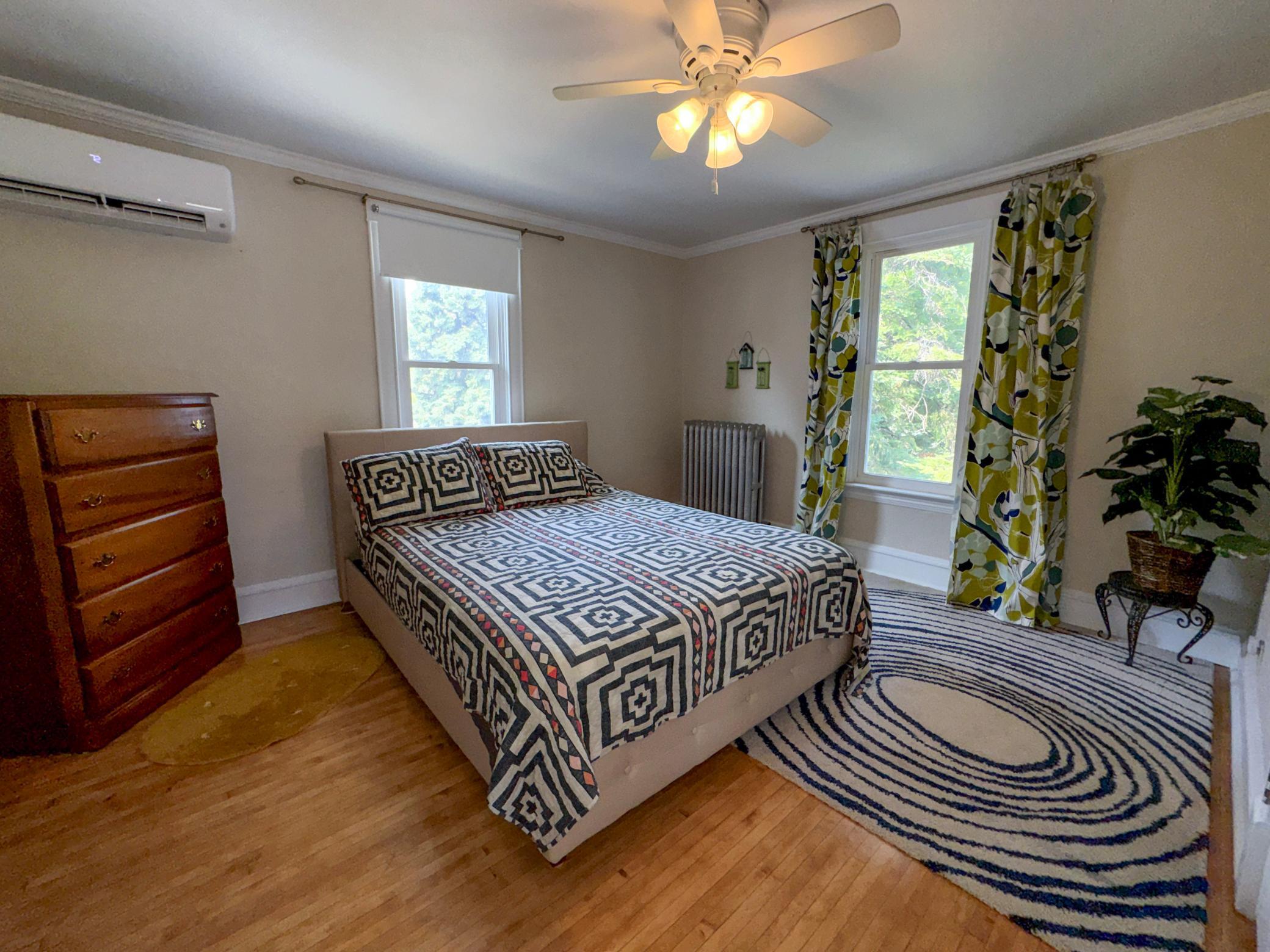 Bright upper-level bedroom full of Victorian character.