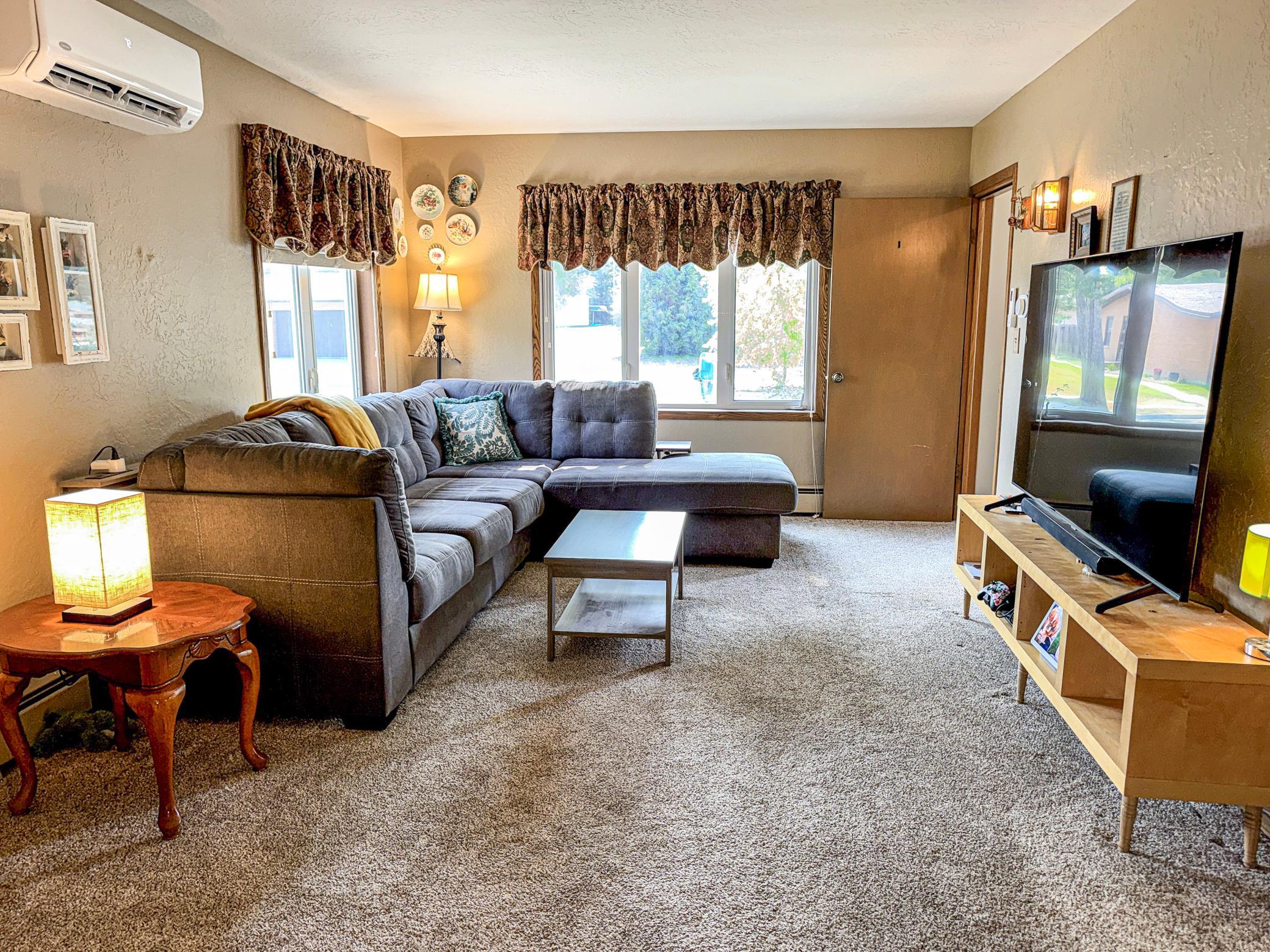 Bright and spacious main-level living room with plenty of room for gathering.