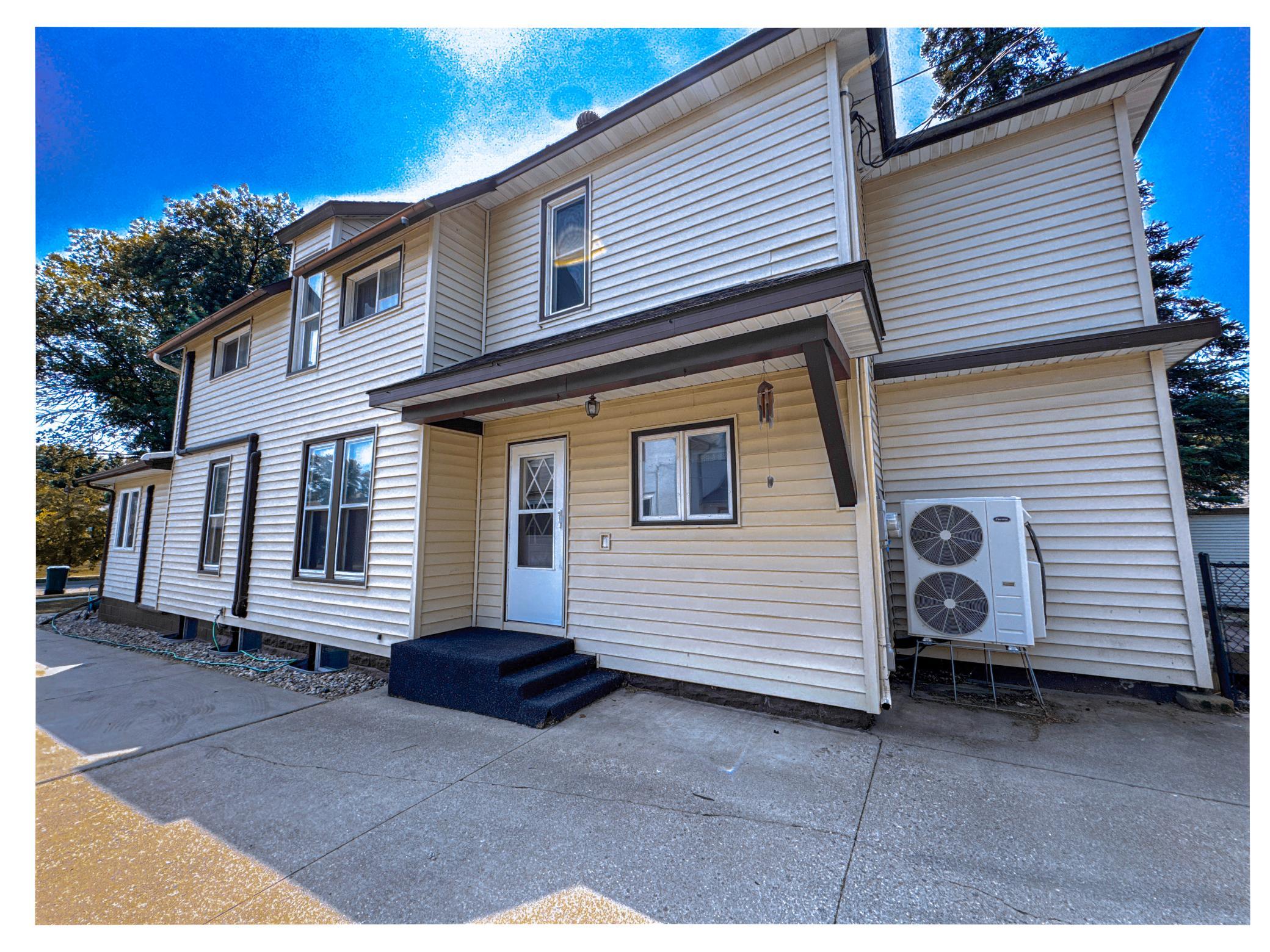 Spacious 4,300+ sq. ft. home in Creston, MN with timeless curb appeal and a long concrete driveway. Convenient kitchen entrance makes unloading groceries quick and easy.
