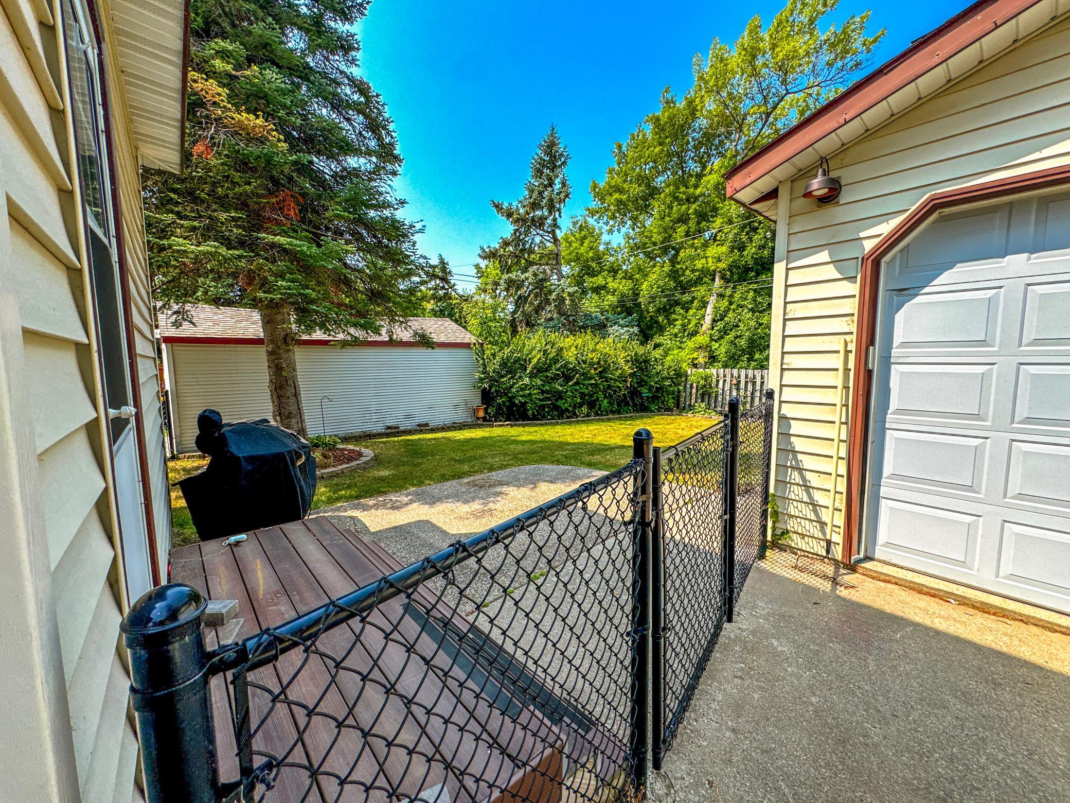 Enjoy quiet evenings on the backyard patio overlooking the fenced yard.
