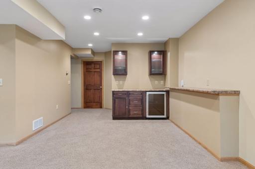 The dry bar offers bonus recreation space and a beverage fridge.