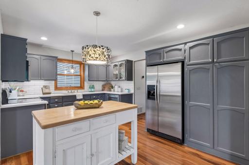 Fully-equipped with stainless steel appliances, subway tile backsplash and Quartz countertops.