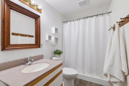 This lower 3/4 bathroom has brand-new LVP flooring.