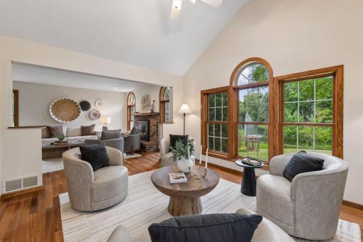 This opens to a vaulted breakfast room addition with abundant natural light.