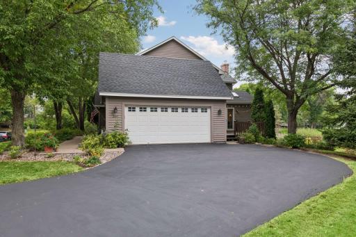 Two-stall garage and a long, turned driveway that was just blacktopped August 2026.
