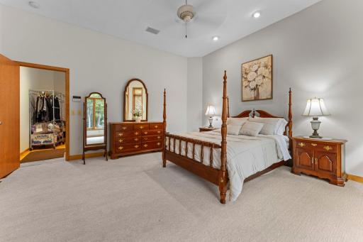 Spacious primary bedroom with private hallway to en suite.