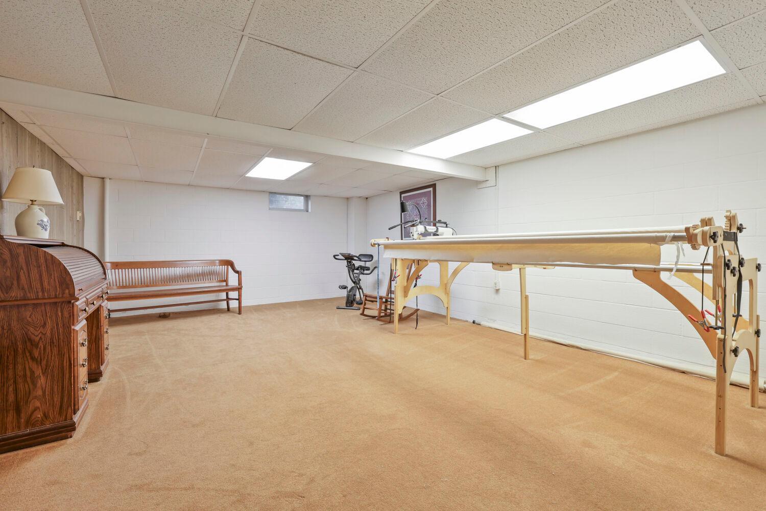 The lower level family room has potential for all sorts of fun, games and hobbies.