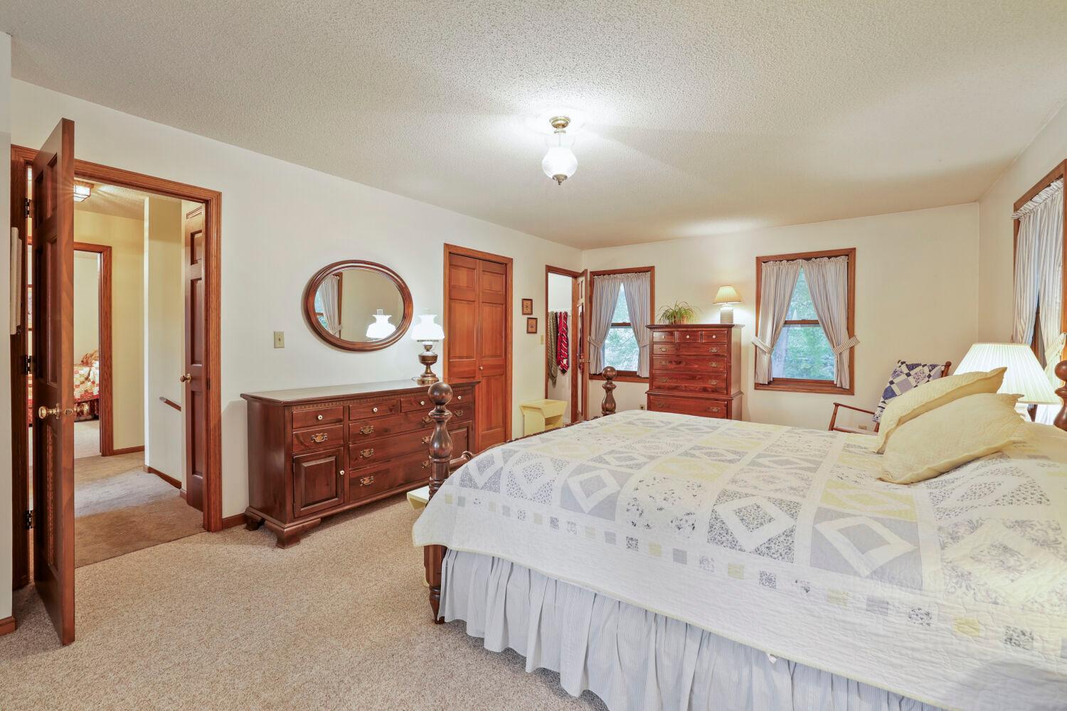 The main bedroom is as large as the width of this home.