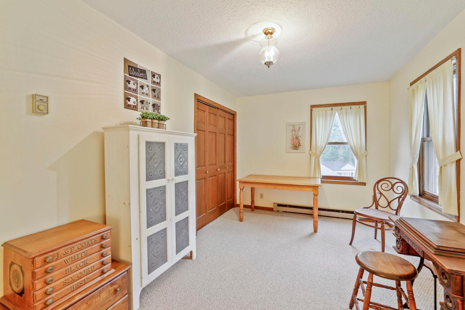 Bedroom 3 with 6-panel closet doors.