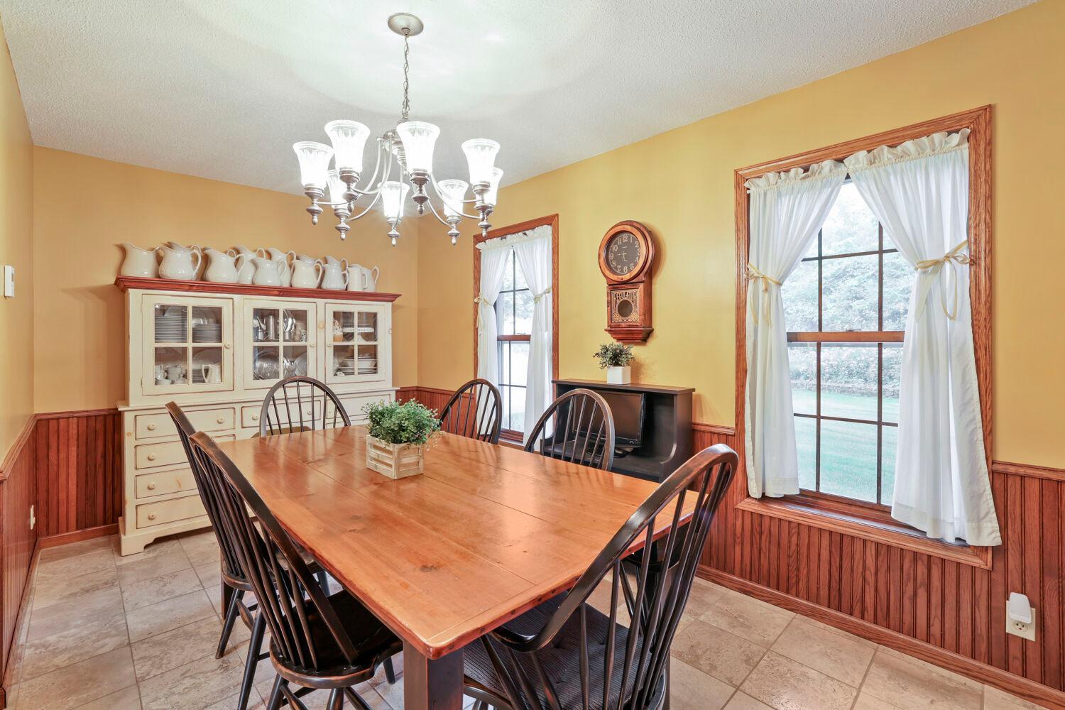 Located just off the kitchen, the dining area and kitchen include travertine floors.