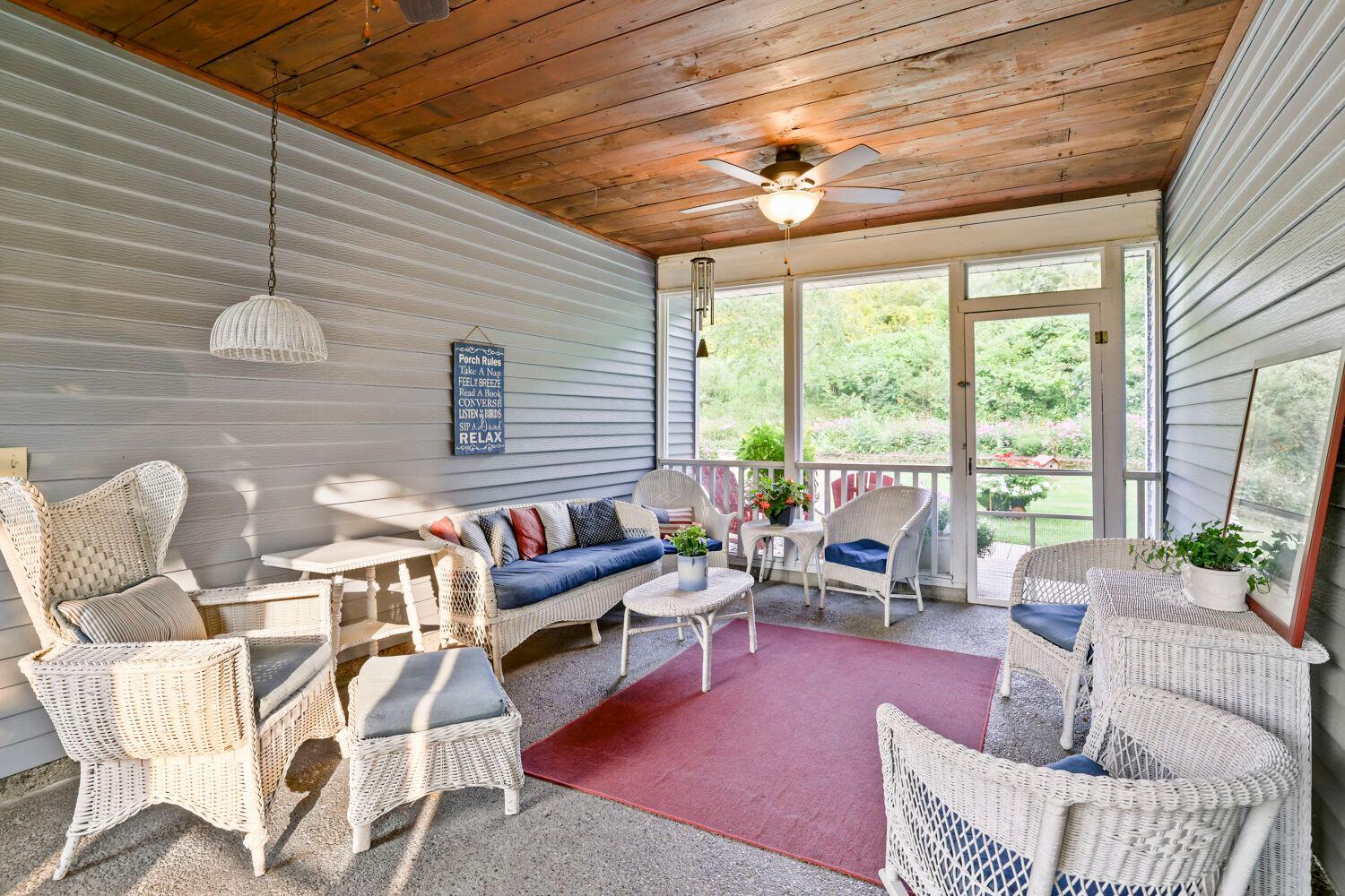 This is where you will find yourself enjoying relaxing time, reading or sitting while watching over the beautiful rolling back yard.
