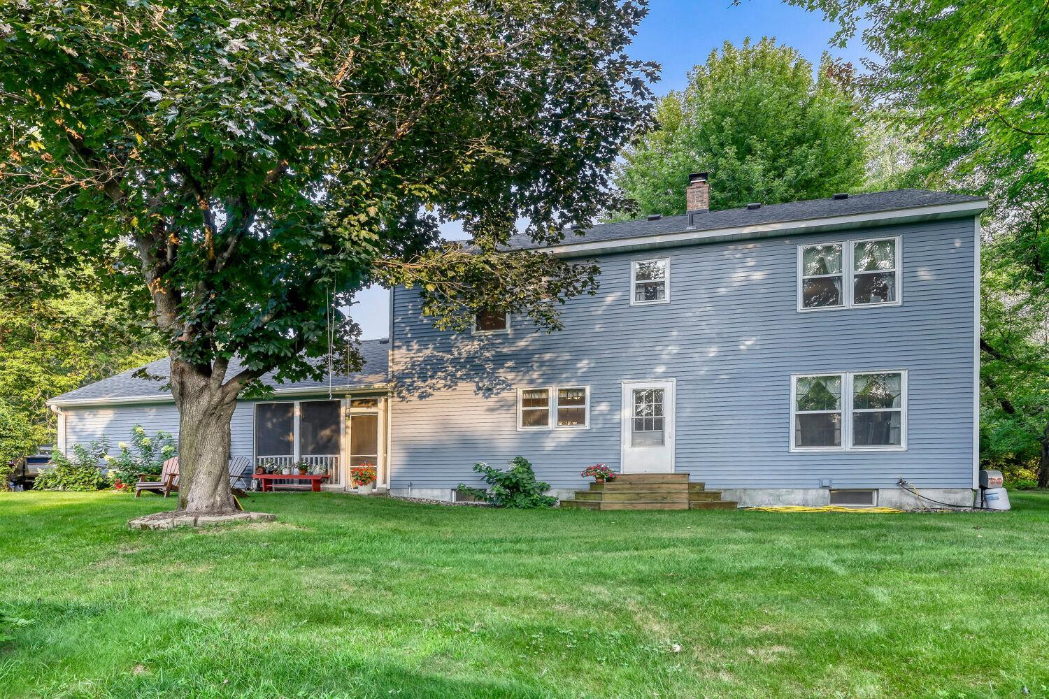 The many mature trees keep this home shaded and cool.