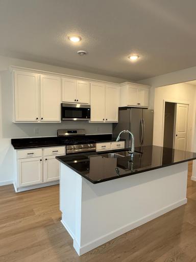 Kitchen with granite countertops and stainless steel appliances
