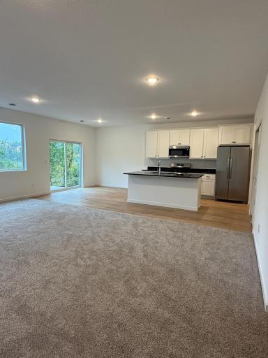 Open floor plan with lots of natural lighting