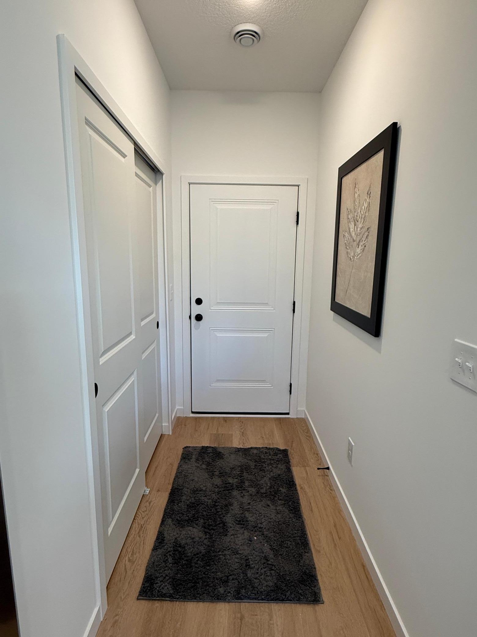 Closet space and entry way to garage