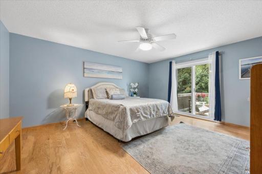 The large primary bedroom has a new sliding door leading to the deck.