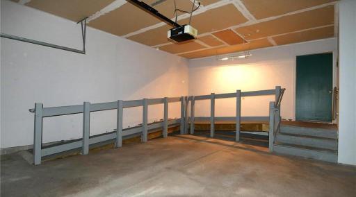 The large wheelchair ramp in the garage shown as empty to see the size and location of the ramp.