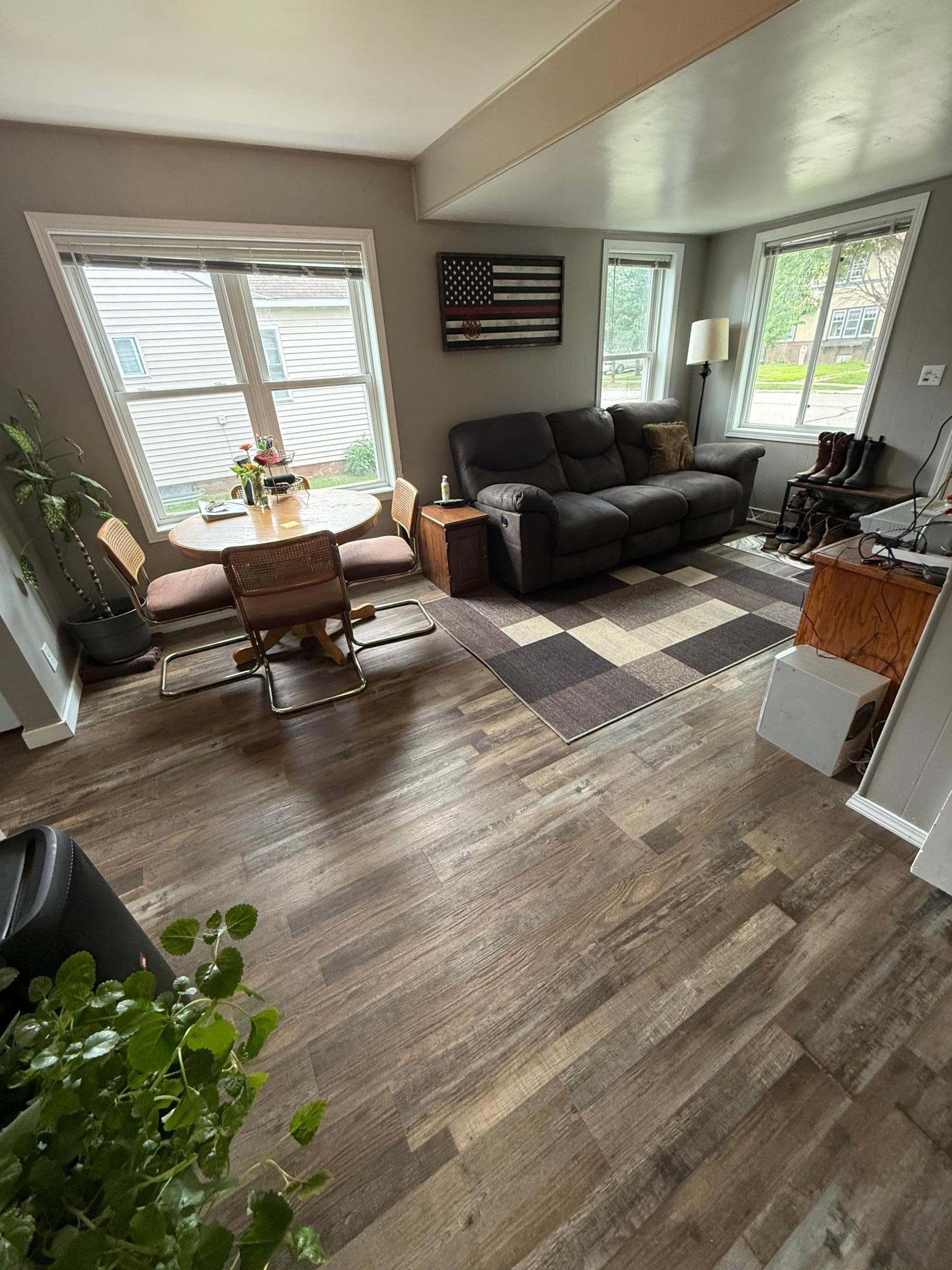 Main floor living room with updated flooring