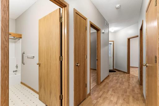 Hallway between the bedrooms and a full bath!