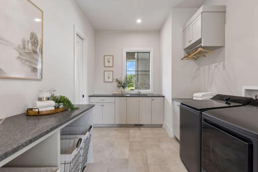 Main floor laundry room with plenty of work space