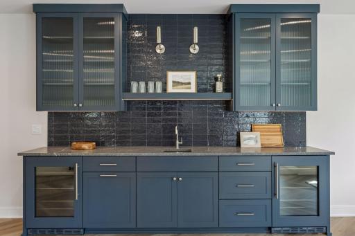 Lower level wet bar with double beverage refrigerators
