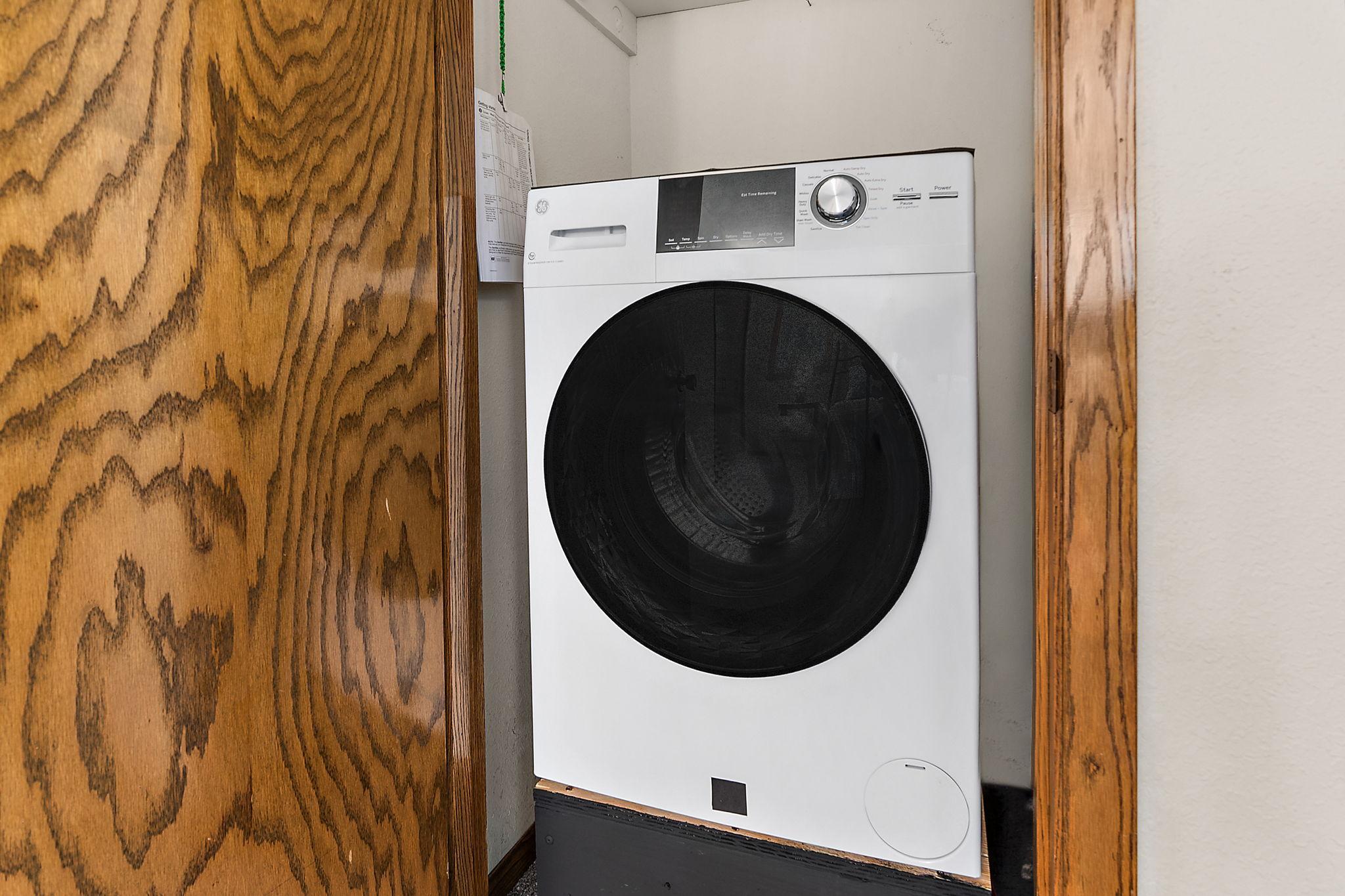 All-in-one washer/dryer in primary bedroom (additional washer/dryer in lower level)