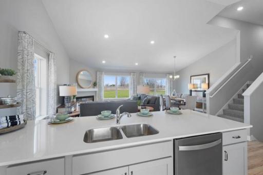 Vaulted ceilings and an open-concept design make this home stand out! Photo of actual Home. Options and colors may vary. Ask Sales Agent for details.