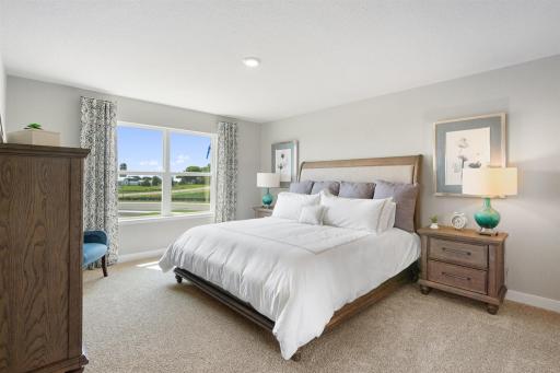 Owner's suite is large enough for a King bed and more. Photo is of model home. Colors and options may vary. Ask Sales Agent for details.