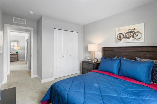 Another upper-level bedroom with abundant space and closet! Photo of model home. Options and colors may vary. Ask Sales Agent for details.