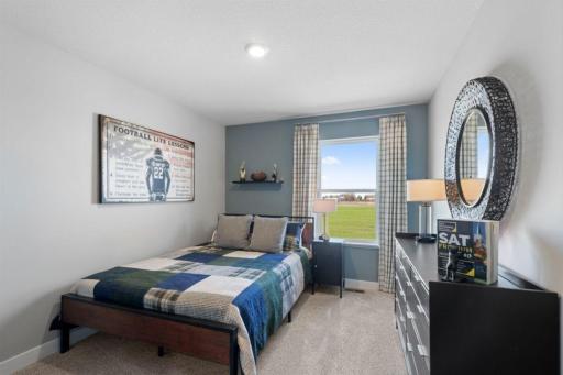 Each of the home's spacious secondary bedrooms feature well thought out window locations. Photo is of actual home. Colors and options may vary. Ask Sales Agent for details.