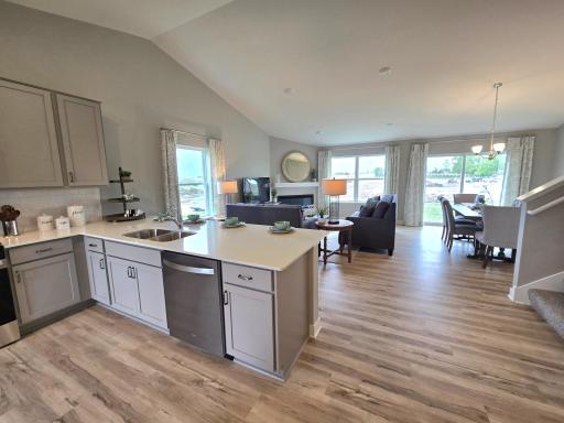 This massive cathedral vault hovers over the entire main level, equating in an openness rarely matched in new home design. Photo is of actual home. Options and colors may vary. Ask Sales Agent for details.