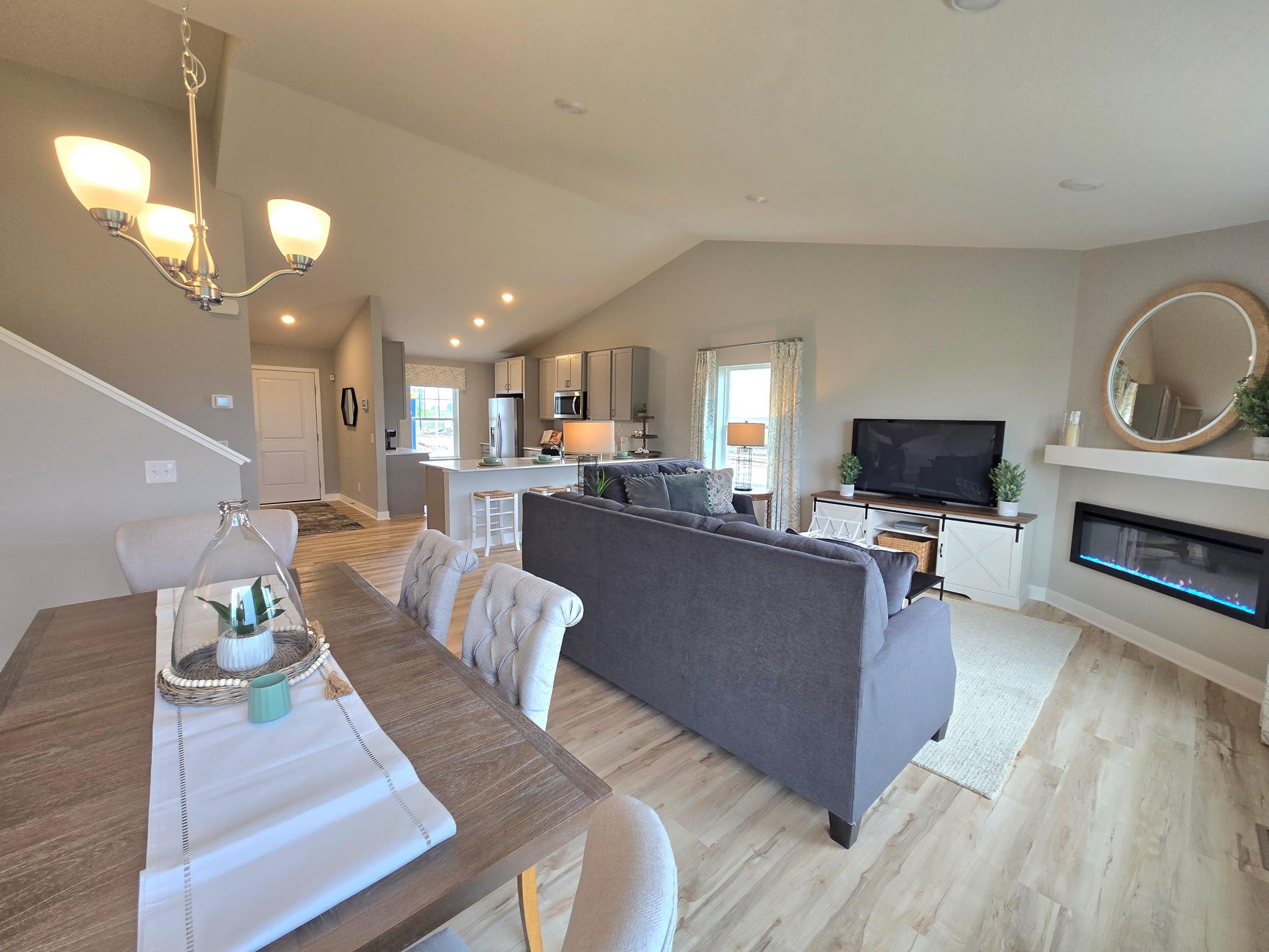 Another highlight to the home, the dining space is close to 15-feet deep and coated in the same hard surface flooring that covers most of the main level. Photo is of actual home. Options and colors may vary. Ask Sales Agent for details.