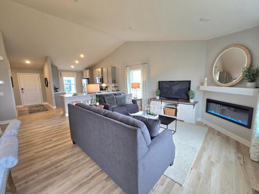 The home's main level living space is loaded with space, and can accommodate just about any family room furniture set-up. Photo is of actual home. Options and colors may vary. Ask Sales Agent for details.