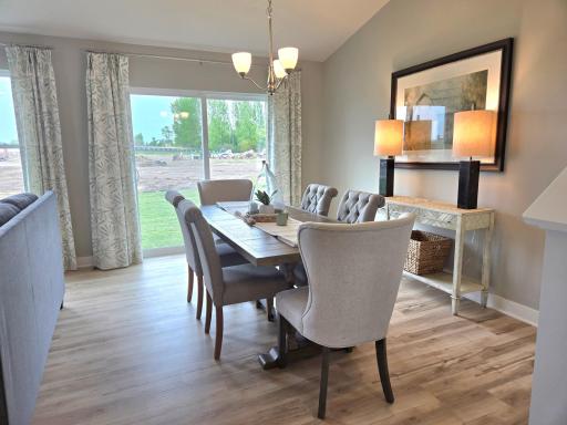 Good sized dining area for many to gather and enjoy. Photo of actual Home. Options and colors may vary. Ask Sales Agent for details.