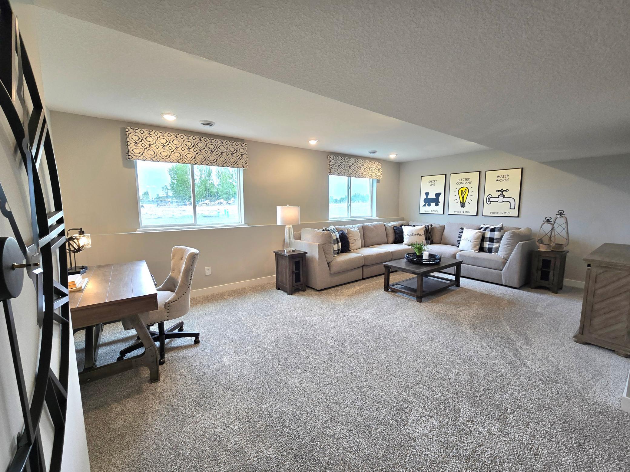 Included finished lower level with family room, bedroom and full bath. Photo of actual home. Options and colors may vary. Ask Sales Agent for details.