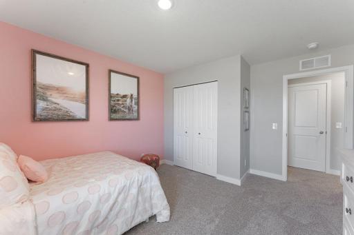 Another view of spacious Bedroom #3. Photo is of actual home. Colors and options may vary. Ask Sales Agent for details.
