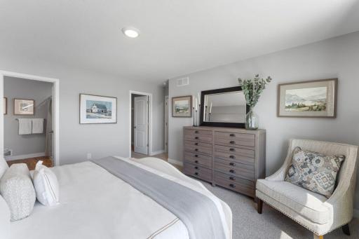 Owner's suite with bathroom en-suite. Photo is of actual home. Colors and options may vary. Ask Sales Agent for details.