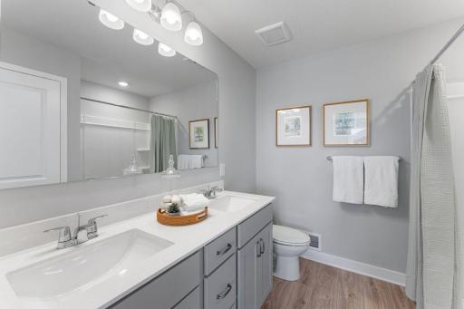 Primary bathroom with raised height vanity and dual sinks. Photo is of actual home. Colors and options may vary. Ask Sales Agent for details.