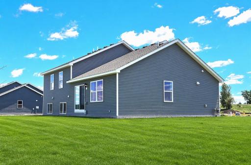 The Bryant II rear view with Lookout at Highlands at Eagle View in Elko New Market. Photo is of a actual home. Options and colors may vary. Ask Sales Agent for details.
