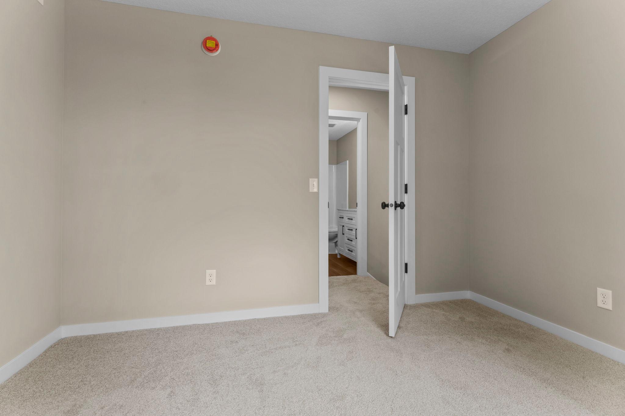 Upper-Level Bedroom #2: Well-appointed with updated finishes, abundant natural light, and ample closet space, this bedroom offers a comfortable and versatile retreat perfect for everyday living.