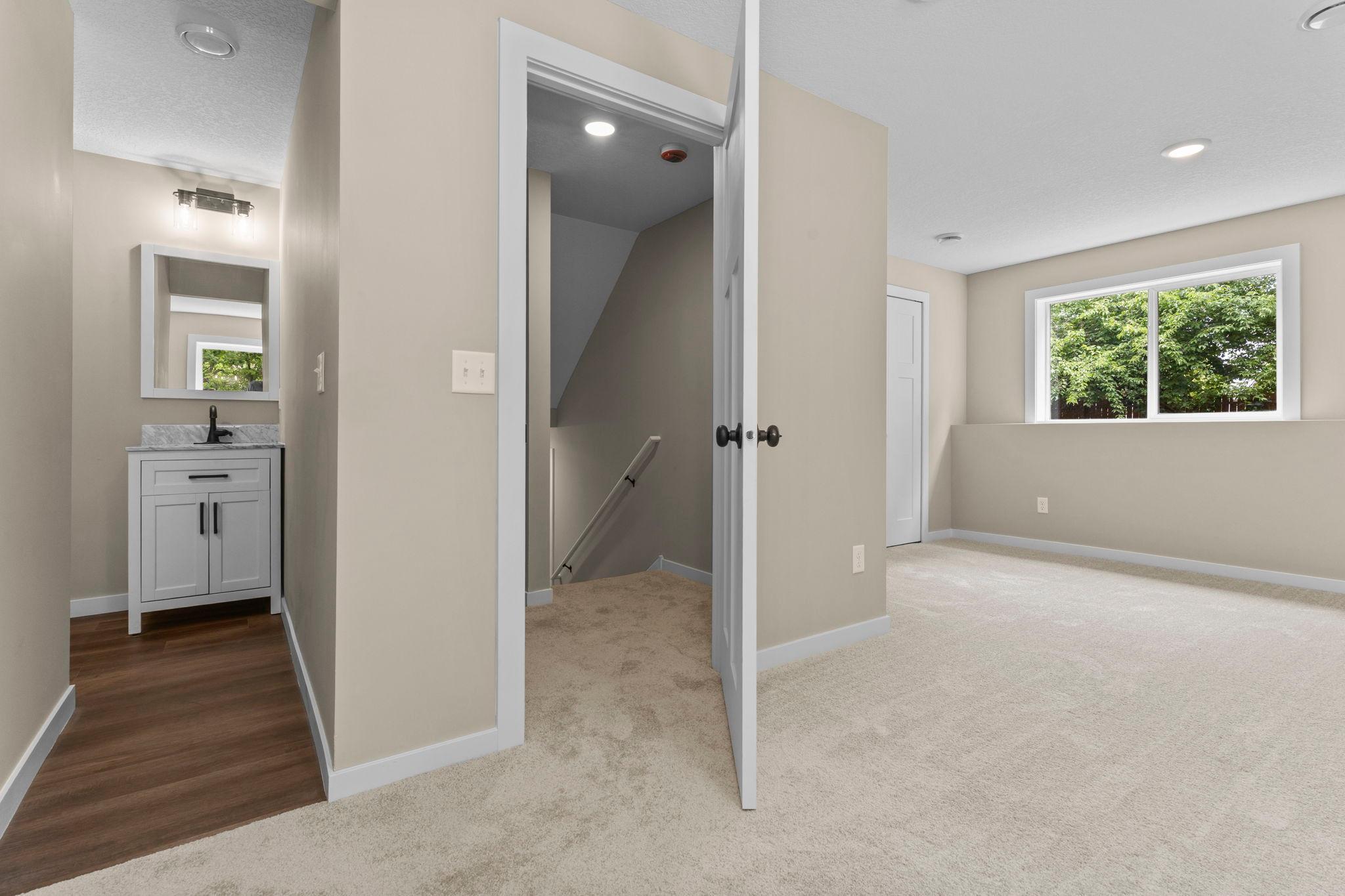 Lower-Level 3/4 Bath: This well-appointed bathroom includes a shower, updated finishes, and a functional layout designed for everyday comfort and convenience.