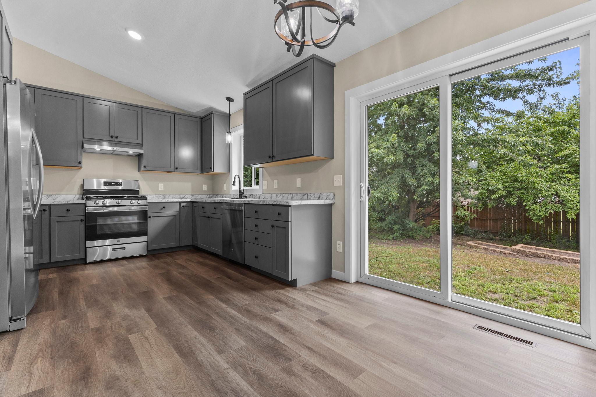 Enjoy a beautifully renovated kitchen featuring sleek stainless-steel appliances, gorgeous new countertops, and contemporary finishes designed for both everyday living and entertaining.