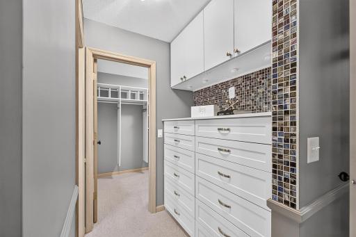 Custom built-in cabinetry in private dressing area.