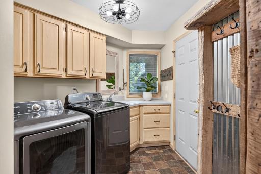 Main level laundry room completes the main floor living concept.