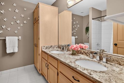 Upper level guest/family bath with double sinks and custom vanity.