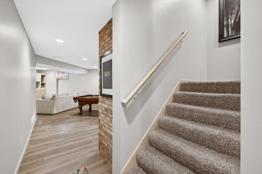 Wide stairwell takes you to a whole other level for entertaining and daily living.