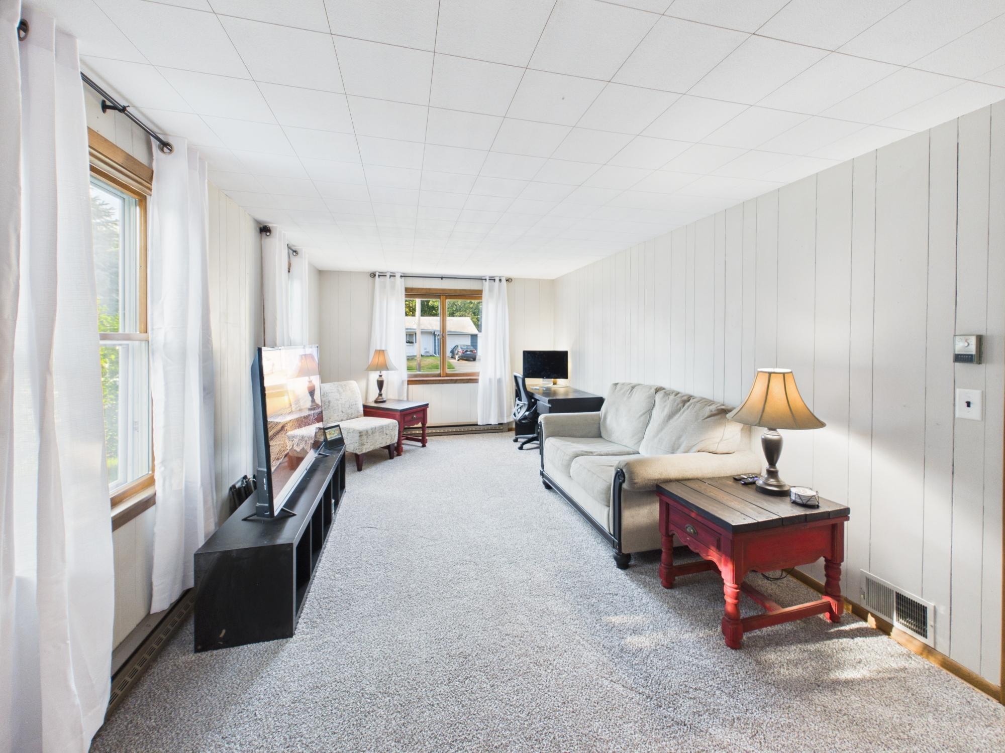 Full-length view of the family room showing just how much additional living space this home offers.