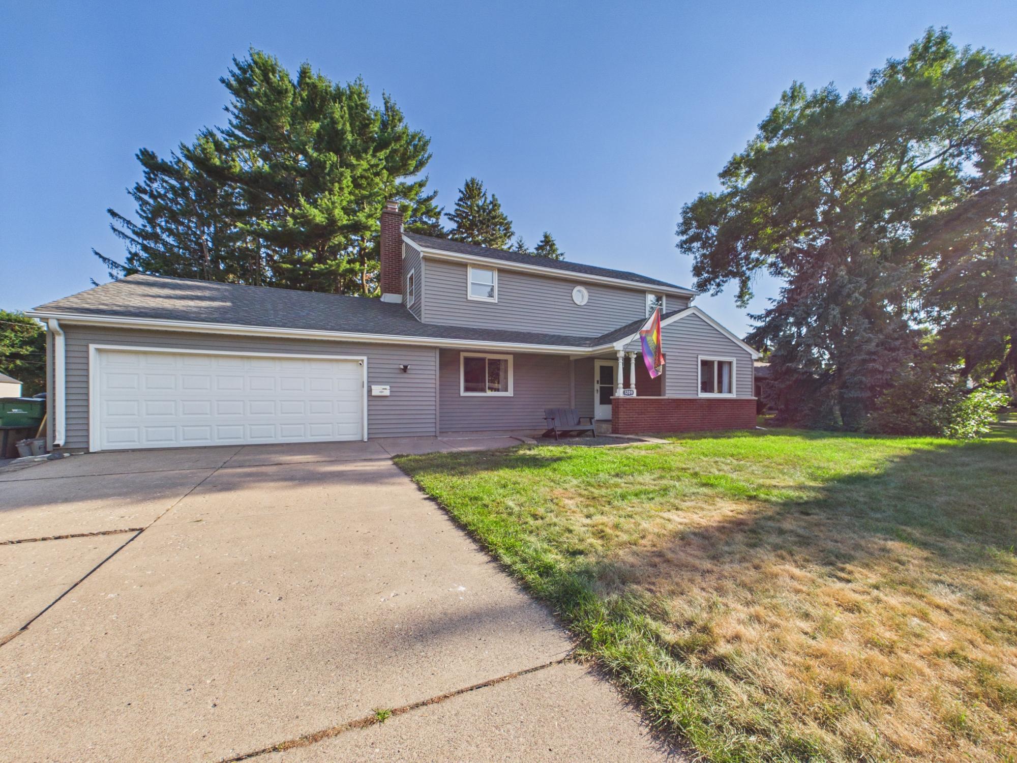 Driveway and front exterior view showing the attached two-car garage